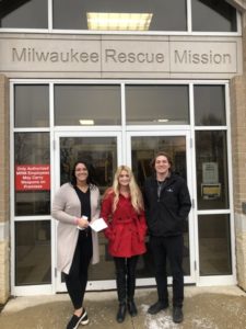 Devon, Alec, and Carly standing in front of the Milwaukee Rescue Mission building