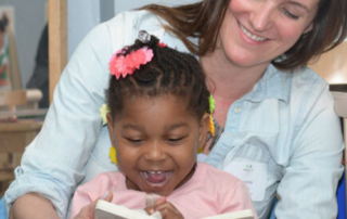 Amanda Dalnodar of Brew City Marketing reading a book to a child at the Next Door Foundation